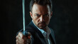 © FH Media Design - businessman in suit holding sword in his hand