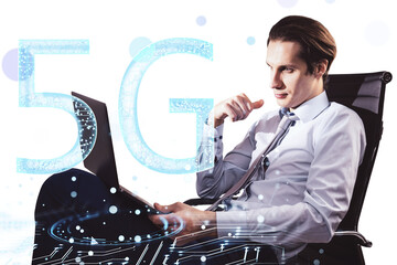 Canvas Print - Businessman using a laptop with 5G network technology concept, featuring digital elements and futuristic design on a white background. Concept of modern technology and connectivity