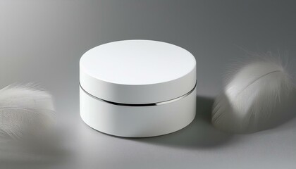 Minimalist white cosmetic jar on a soft background, perfect for skincare or beauty product packaging.