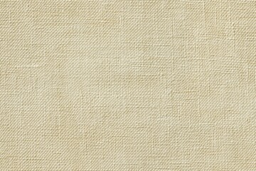 Textured fabric cotton canvas surface in a neutral beige color. The fabric has a natural, woven appearance, suitable for backgrounds or textile-related designs.