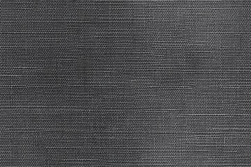 Textured black cotton canvas fabric, showcasing a woven pattern. The fabric appears smooth with subtle variations in shade, creating a sophisticated look.