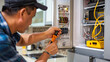 © Jafree - Asian man is using a multimeter to work on an electrical circuit breaker in a kitchen environment. Concept of electrical repair, maintenance, safety inspections, and home renovation