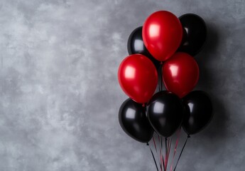 Poster - Colorful red and black balloons tied together against a textured gray background for celebrations