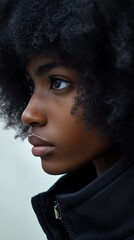 a young woman with an afro hair style