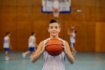 Sticker - Child with basketball in front of hoop