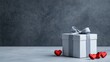 © Nima - A charming gift box adorned with a grey ribbon, accompanied by red hearts, symbolizing love, celebration, generosity, affection, and connection.