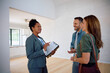 © Drazen - Black real estate agent talking her clients while showing them new apartment for sale.