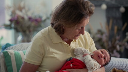 Grandmother gently holding her newborn grandchild, highlighting the strong intergenerational family bond and warmth in a loving home environment