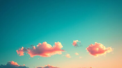 Wall Mural - A serene sky filled with soft, pink clouds against a gradient blue backdrop, evoking a sense of tranquility and beauty.