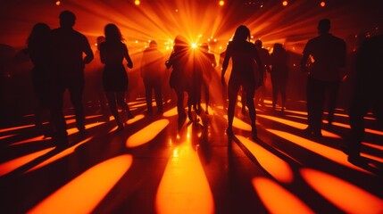 Poster - Silhouetted dancers in a vibrant, illuminated space create an energetic atmosphere.