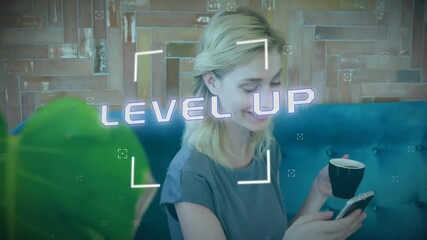 Poster - Animation of level up text and data processing over caucasian woman using smartphone