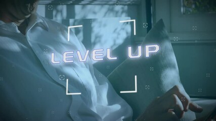 Poster - Animation of level up text and data processing over caucasian businessman using smartphone