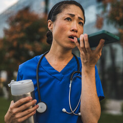 Wall Mural - Angry mature japanese woman doctor record voice mail on mobile phone