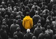 © Patryk - Person in full bright colour and saturiattion standing among a crowd of people in black and white