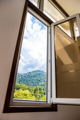 cloudy sky over mountain in window in Dilijan