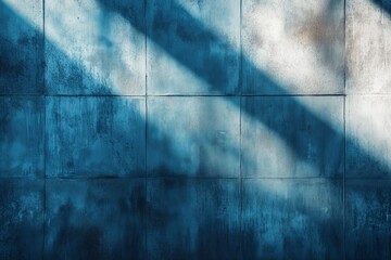 Abstract grungy shabby dark blue wall texture with sun light and shadows, abstract background