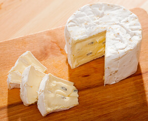 Wall Mural - Image of slices of cambozola cheese on desk, french cuisine