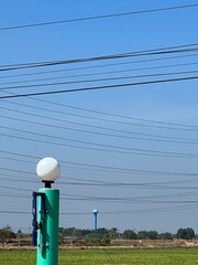 Poster - power line and electric poles on green field background