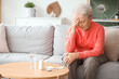 © Pixel-Shot - Sick senior woman with pills at home