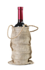 Poster - Wine bottle in burlap bag isolated on white