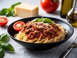 © Rizky Rahmat Hidayat - Pasta spaghetti bolognese with minced beef sauce, tomatoes, parmesan cheese and fresh basil in a plate.
