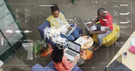 Canvas Print - Top view of diverse people working on laptops, data processing animation over them