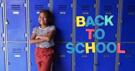 Poster - Animation of back to school text over biracial schoolgirl smiling