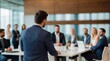 © VistaVisions - Confident businessman giving a presentation in front of crowd in meeting conference seminar room. Leadership authority teamwork in business concept