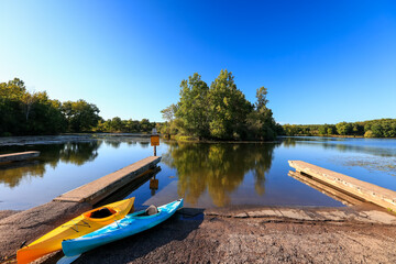 Wall Mural - kent lake in kensington metro park with boat access and two kayaks at the shore.