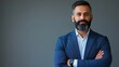 © yang - Proud confident bearded indian business man investor, rich ethnic ceo, corporate executive, professional lawyer banker, male office employee standing isolated on gray with arms crossed. Portrait