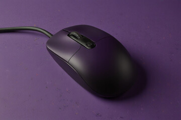 purple computer mouse with a purple background