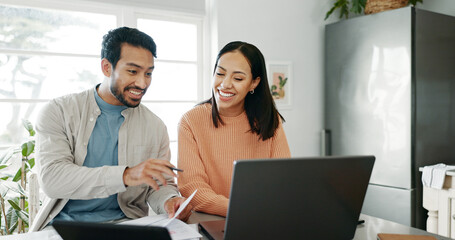 kitchen, couple and discussion with laptop for budget, track expenses and planning for financial goa