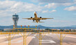 © muratart - White Passenger plane fly up over take-off runway from airport - El Prat-Barcelona airport. This airport was inaugurated in 1963 - Barcelona, Spain