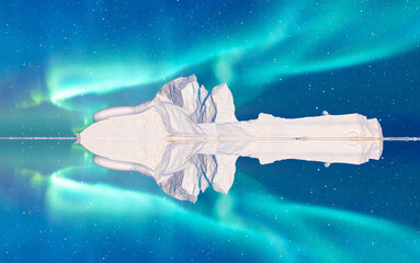 Wall Mural - iceberg floating in greenland fjord with aurora borealis - greenland