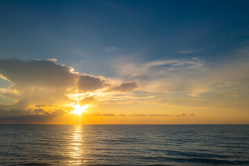 Sea beach with sky sunset or sunrise. Cloudscape over the sunset sea. Sunset at tropical beach. Nature sunset landscape of evening sea.