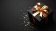 © cobaltstock - Beautiful black gold gift with copy space