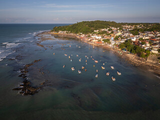 Beautiful aerial view to fishing and tour boats docked in Pipa