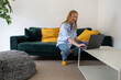 © Cavan - woman freelancer working on laptop at home