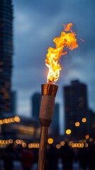 Poster - A flaming torch stands tall against the backdrop of a city skyline at dusk.