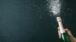 © 9DIGITECH - People jubilantly opening a champagne bottle, with the cork flying and the bubbly liquid spraying in a joyous burst. Perfect for celebrating special occasions, parties, and festivities.