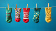 © thanakrit - Colorful Socks Hanging On A Clothesline Against A Blue Background.