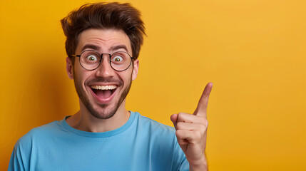 a man with glasses is pointing at something and smiling