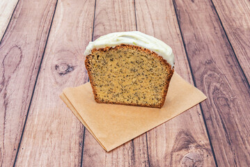 Wall Mural - A slice of lemon and poppy seed cake with sugar topping