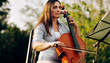 © StarDweller/peopleimages.com - Music, learning and cello with woman in nature for classical, prodigy and orchestra performance. Artist, creative and theater with person playing instruments in park for band practice and talent