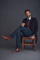 Poster - Studio, smile and portrait of businessman on chair for writing career, literary and confidence. Happy, author and pride on stool for publishing company, fashion and elegance by gray background