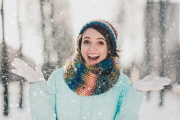 Sticker - Photo of happy cheerful pretty amazed young woman snow fall december happy mood in park outside outdoors