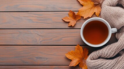 Wall Mural - A cup of tea on a wooden table with autumn leaves, AI