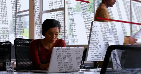 Poster - Animation of financial data processing over biracial businesswoman using laptop in office