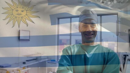 Poster - Animation of flag of uruguay over caucasian male surgeon in hospital