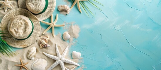 Poster - A top down view of beach items placed on a soft pastel blue backdrop creating a charming summer holiday setting with ample copy space image availability